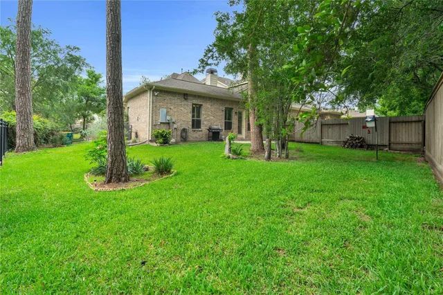 a view of a house with a yard and sitting area