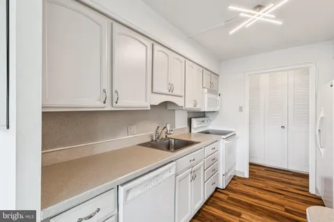 a kitchen with a sink and cabinets