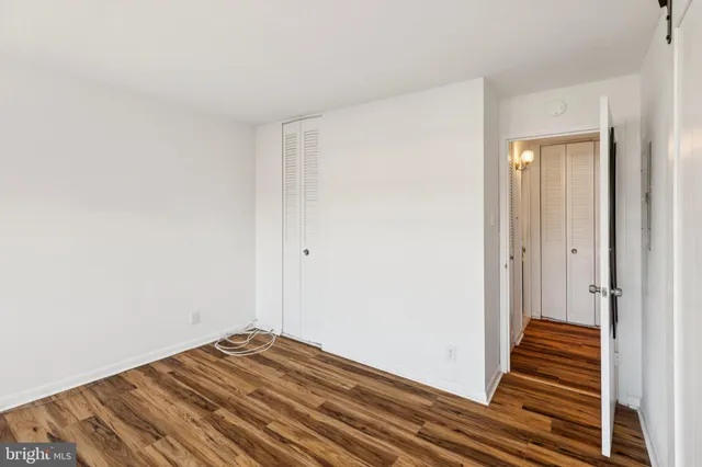 a view of a room with wooden floor and stairs