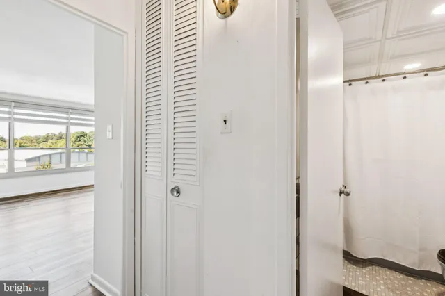 a bathroom with a shower and a window