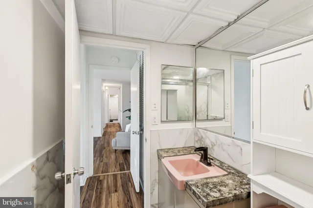 a bathroom with a sink and mirror