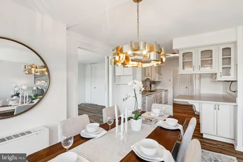 a very nice looking dining room with a table and chairs