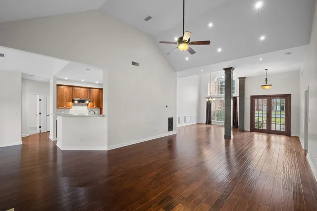 an aerial view of a house with a yard
