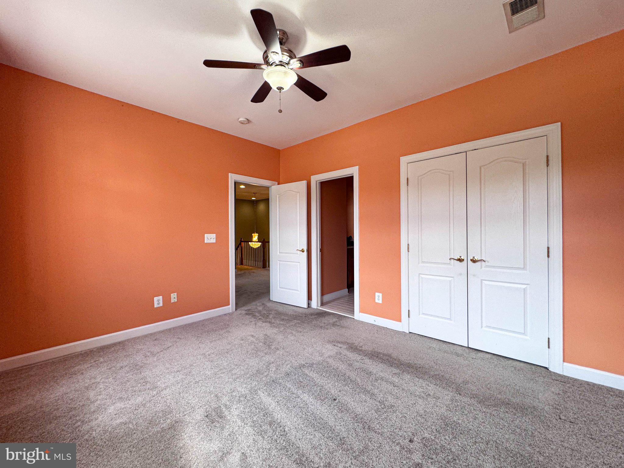 22827 Oakgrove Road Sterling, VA 20166 - Photo 16 of 56 Vibrant orange walls invite creativity.