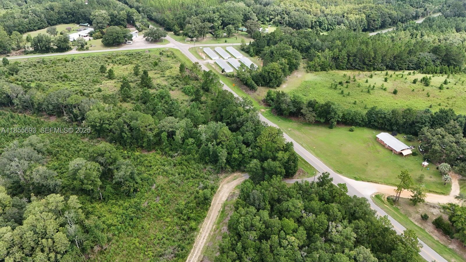 0 Pate Pond Road Caryville, FL 32427 - Photo 11 of 12 an aerial view of residential houses with outdoor space and trees