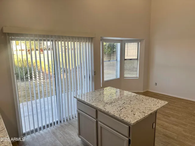 a view of kitchen island with furniture and wooden floor