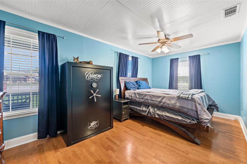 710 South Old Temple Road Lorena, TX 76655 - Photo 10 of 19 Bedroom featuring light wood-type flooring, ceiling fan, and crown molding