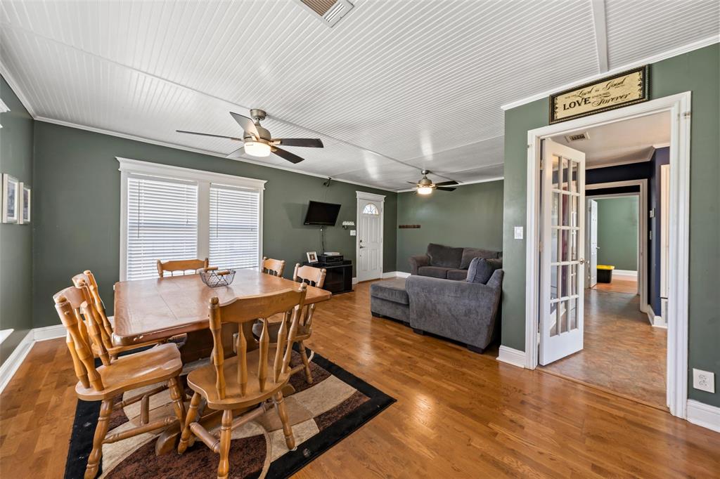 710 South Old Temple Road Lorena, TX 76655 - Photo 5 of 19 Dining area with ceiling fan, wood finished floors, and crown molding