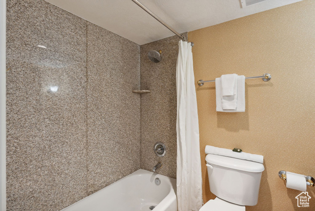 784 Resort Drive, Unit 206 Midway, UT 84049 - Photo 8 of 21 Bathroom featuring shower / bath combination with curtain, toilet, and a textured ceiling