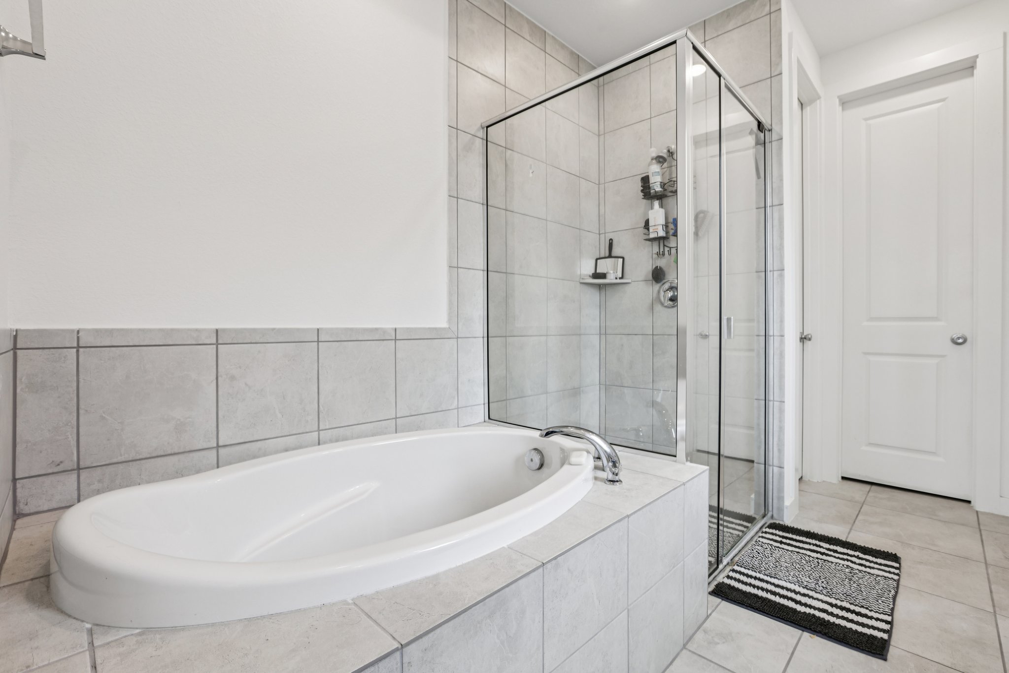 930 Nautical Loop Kyle, TX 78640 - Photo 12 of 25 Relax in the soaking tub after a long day or get ready ready for the day with a refreshing shower! Don't forget to see the extra large walk-in closet!