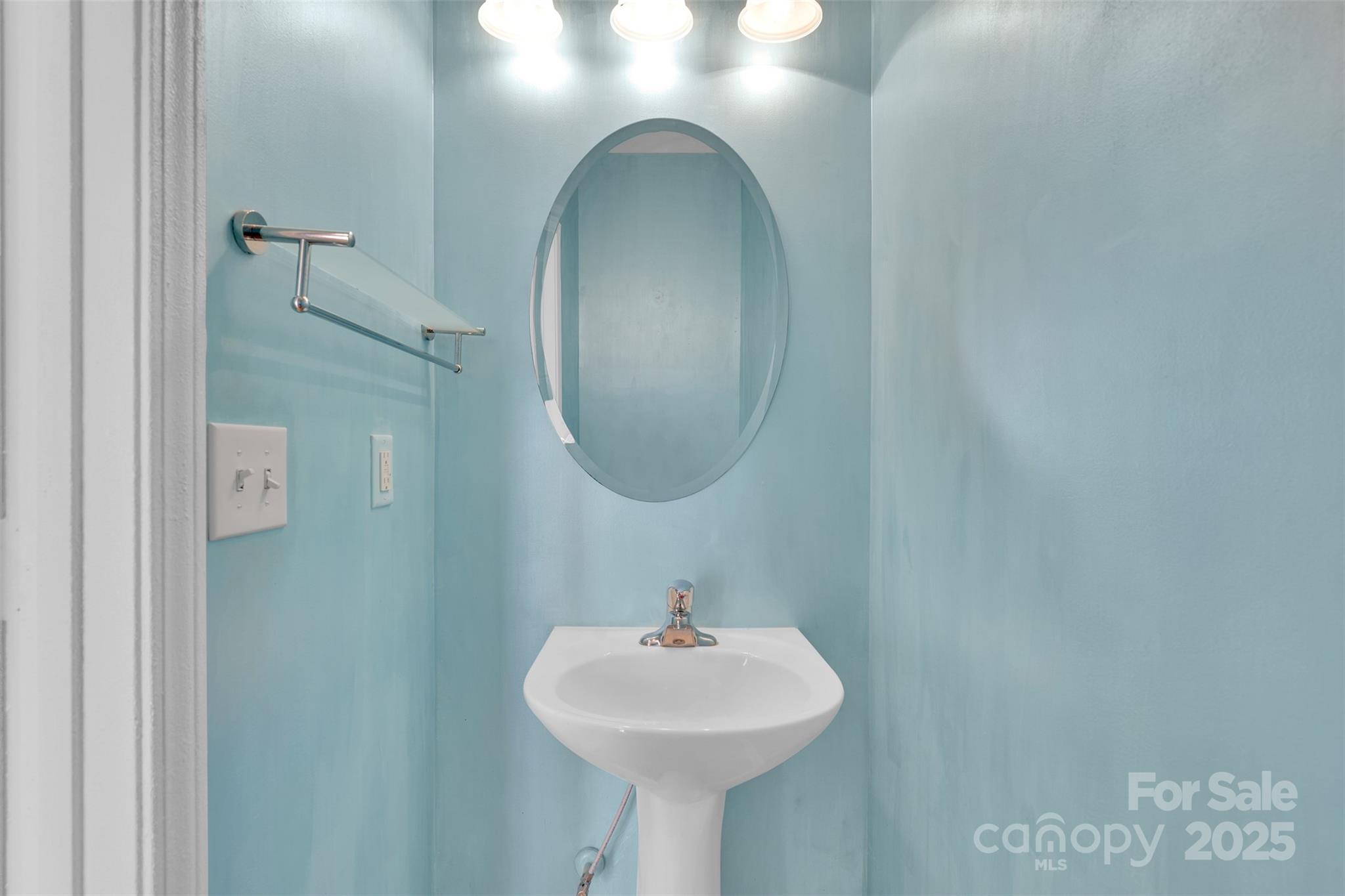 649 Raphael Place Charlotte, NC 28205 - Photo 14 of 47 a bathroom with a sink and a mirror