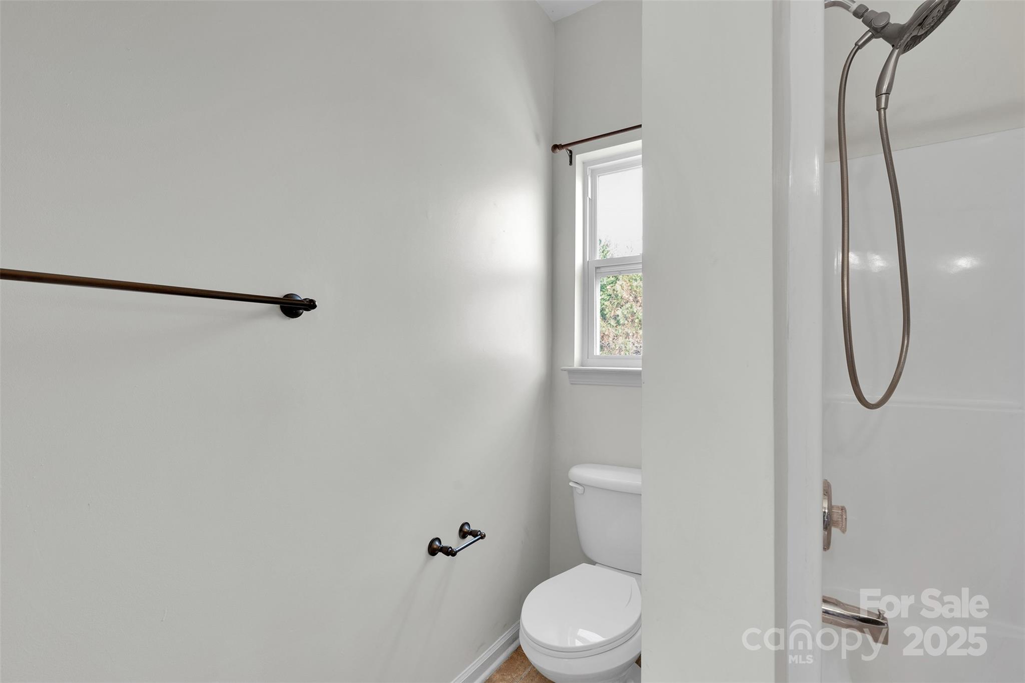 649 Raphael Place Charlotte, NC 28205 - Photo 22 of 47 a white toilet sitting next to a bathroom sink