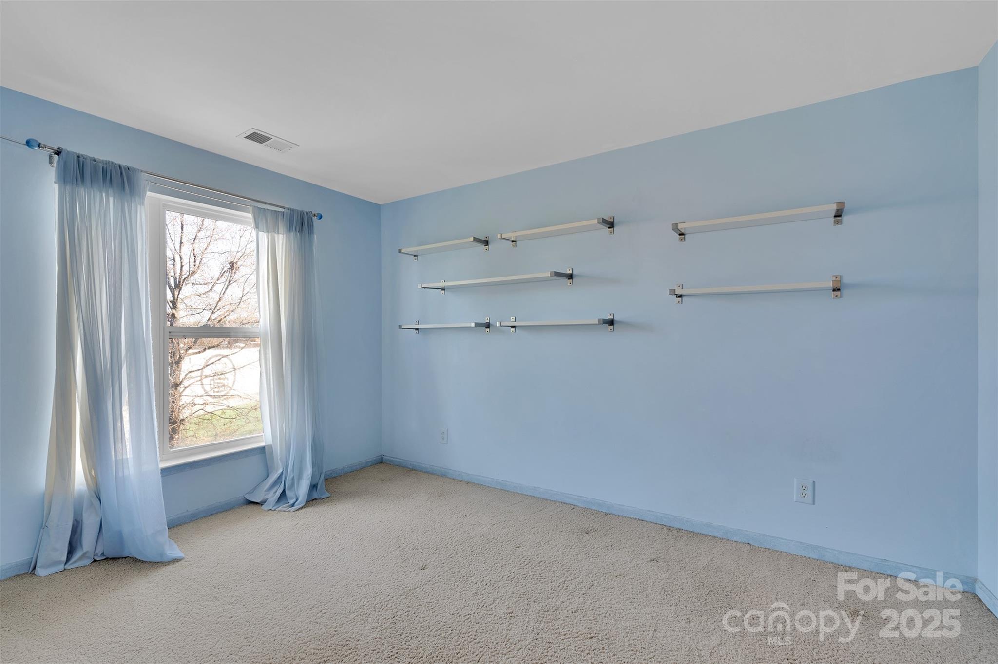 649 Raphael Place Charlotte, NC 28205 - Photo 28 of 47 a view of an empty room with a window