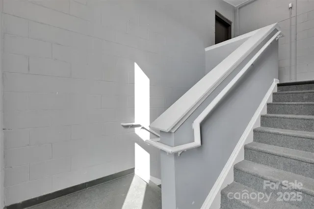 a front view of a residential apartment building with a yard