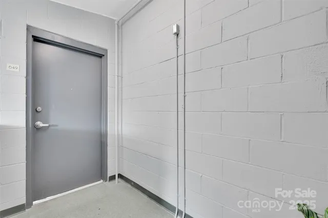 a view of a brick building next to a yard