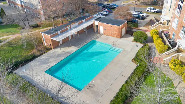 a view of staircase with lots of wooden cabinets