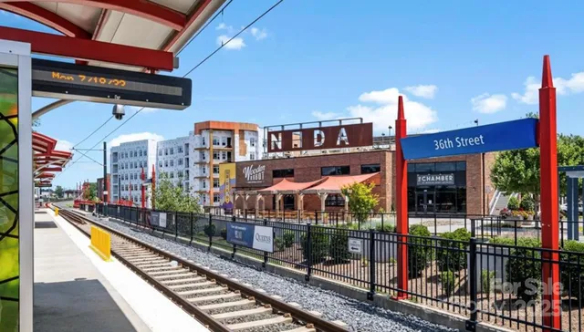 a view of a brick house with many windows