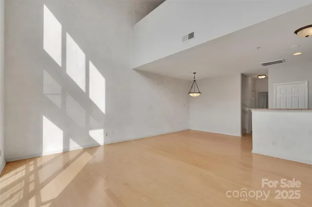 a view of a big room with windows and cabinet