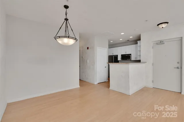 a view of a kitchen with a sink and dishwasher