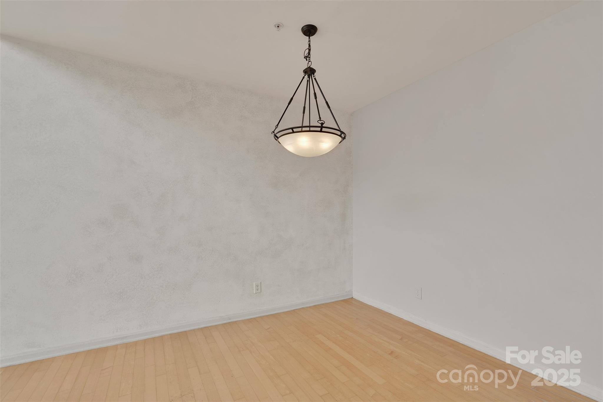 649 Raphael Place Charlotte, NC 28205 - Photo 8 of 47 a view of a room with wooden floor and a ceiling fan