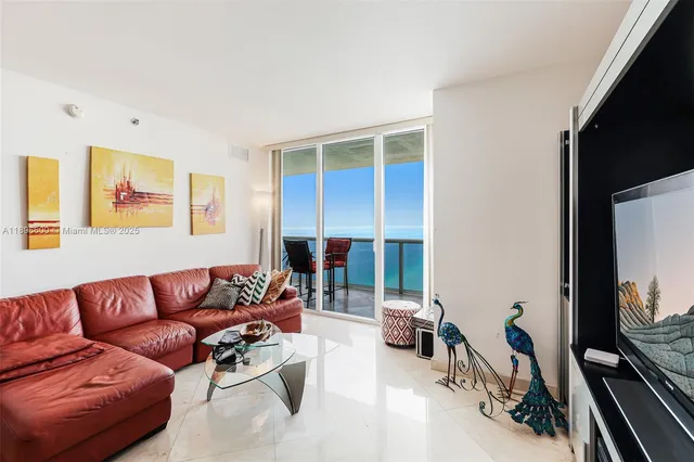 a living room with furniture large window and couch