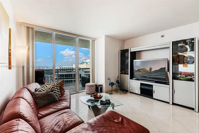 a bedroom with a bed and a chair