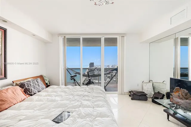 a bedroom with a bed and a cabinets