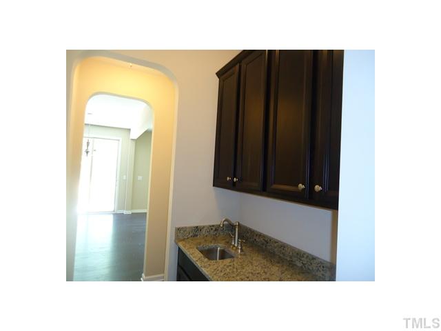 813 Wickham Ridge Road Apex, NC 27539 - Photo 11 of 25 Butlers Pantry with maple cabinets, granite tops and a sink!