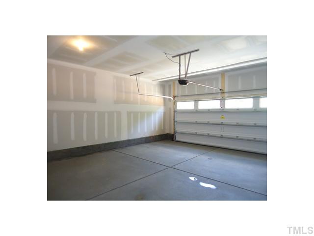 813 Wickham Ridge Road Apex, NC 27539 - Photo 16 of 25 Large two car garage with garage door opener.