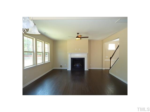 813 Wickham Ridge Road Apex, NC 27539 - Photo 8 of 25 9 ft smooth ceilings, gas fireplace, hardwood floors and HDMI above fireplace!