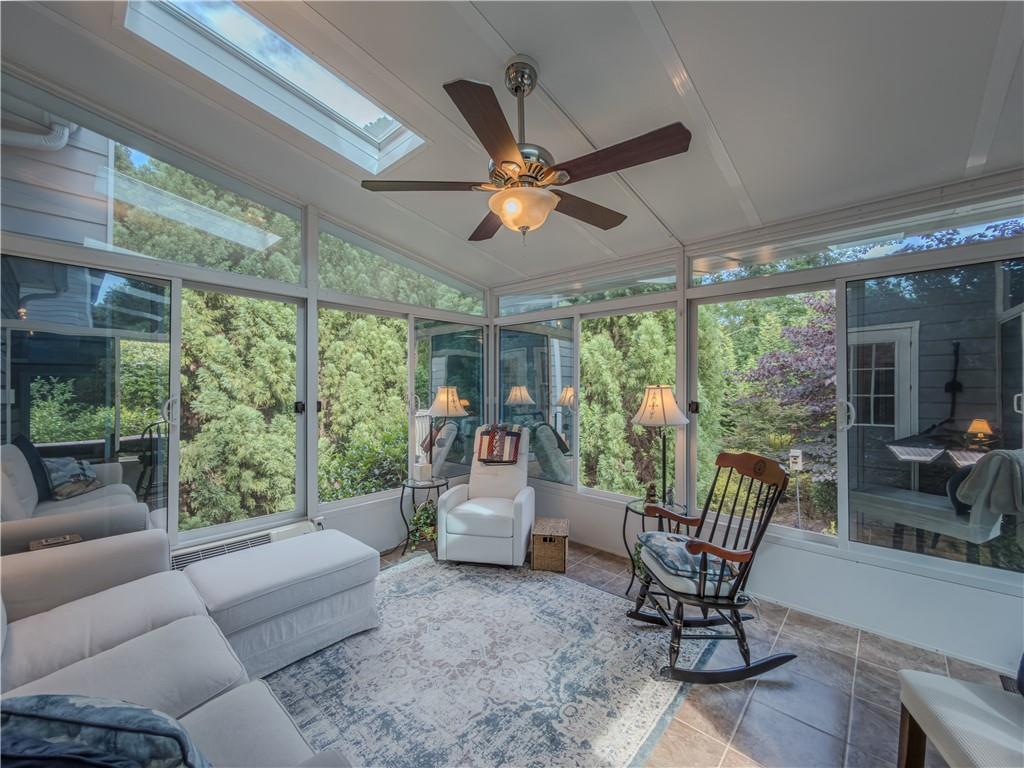 4284 Cedar Bluff Way Southwest Lilburn, GA 30047 - Photo 57 of 62 a living room with furniture and a large window