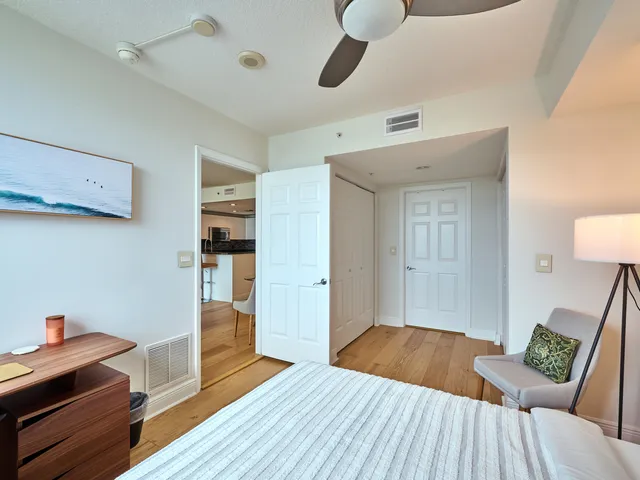 a view of a room with wooden floor and staircase