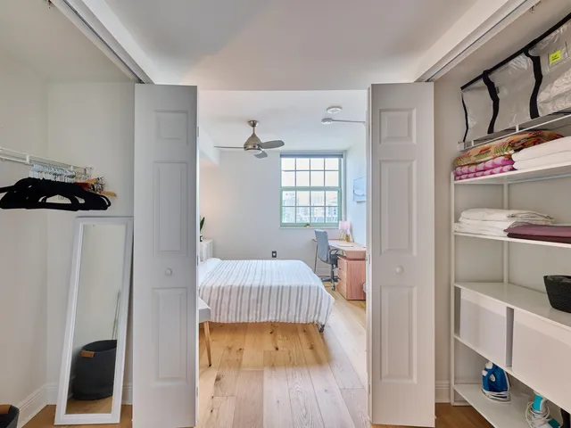 a bedroom with furniture and a window