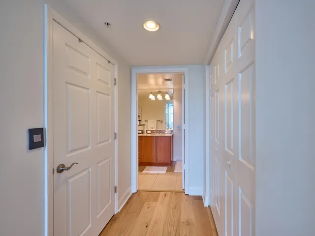 a bathroom with a granite countertop sink a toilet and mirror