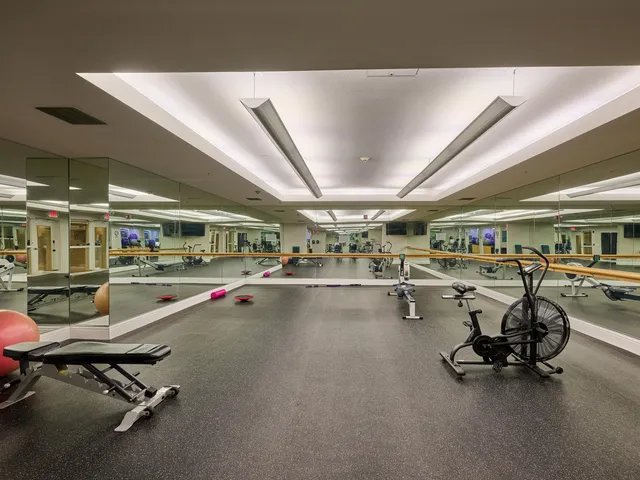 a swimming pool with outdoor seating and yard