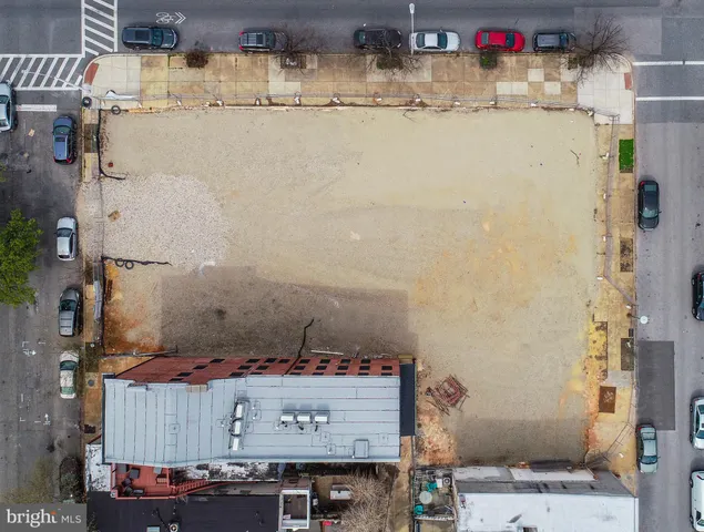 a view of a city street with a building