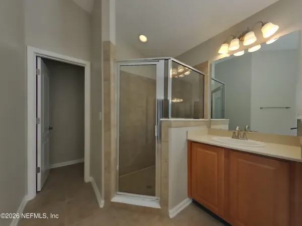 a bathroom with a double vanity sink and mirror