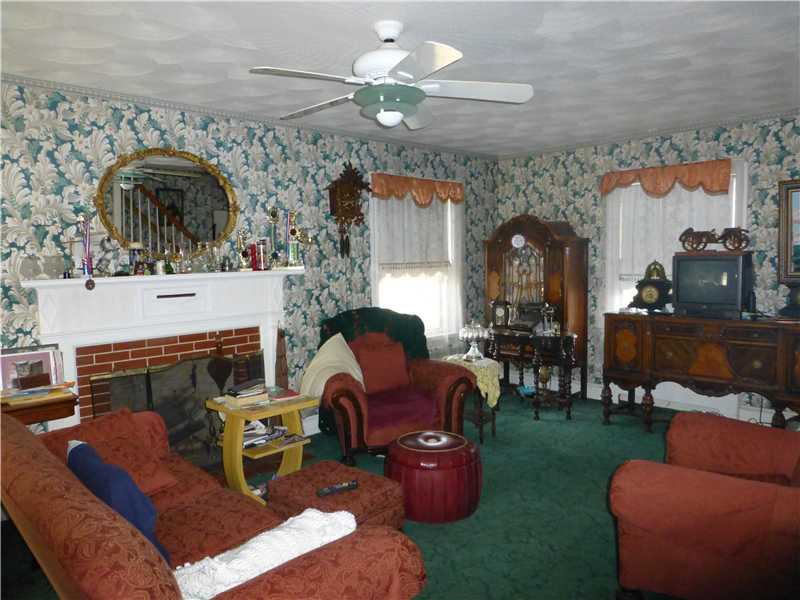 1320 Main Street Coventry, RI 02816 - Photo 5 of 11 Living Room. Living Room with fireplace. Den/Sewing Room off Living Room