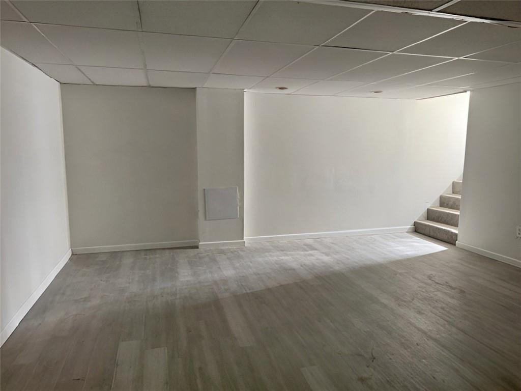 279 Olympic Road Pittsburgh, PA 15236 - Photo 24 of 25 a view of an empty room with wooden floor and stairs