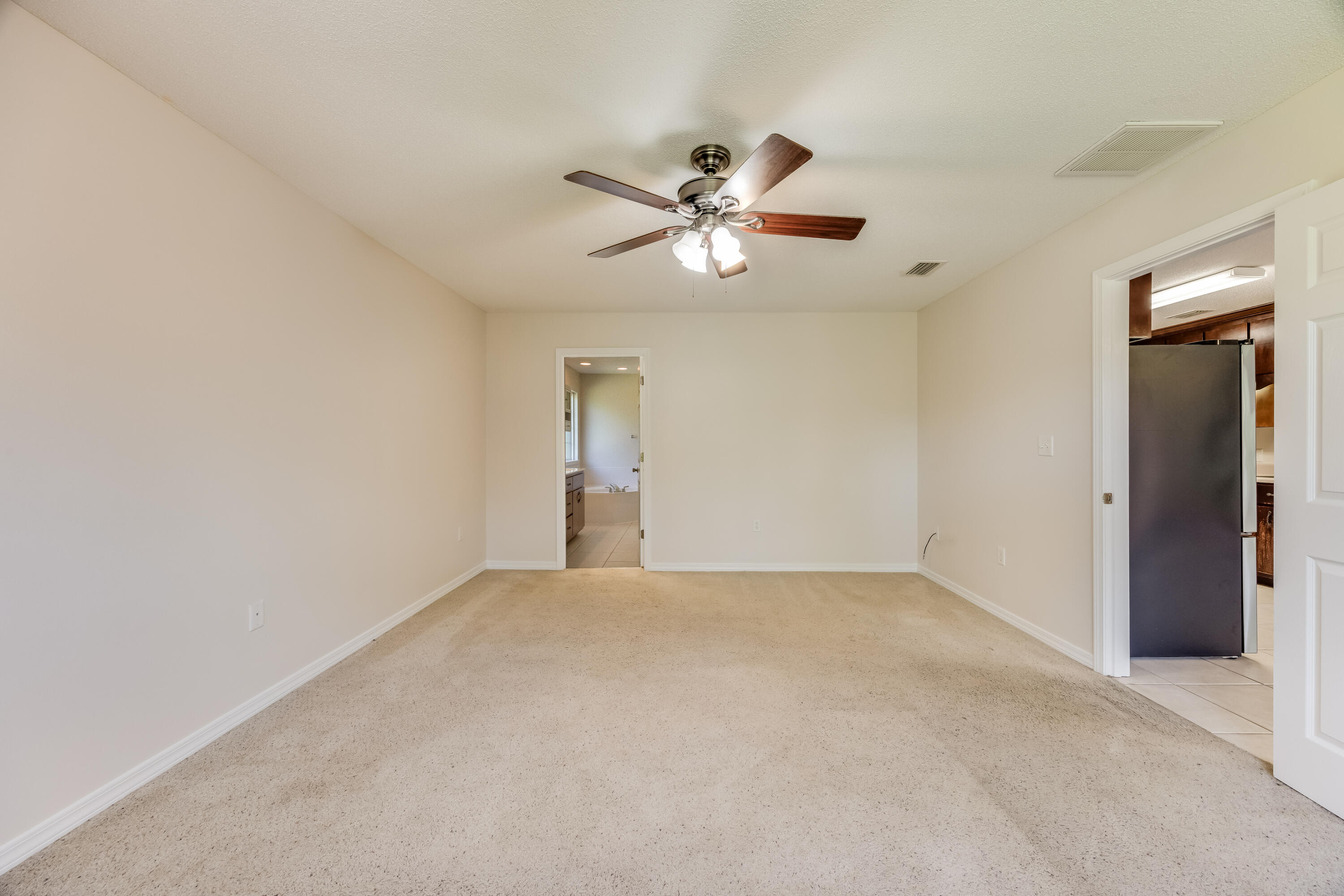 4555 Wolf Track Ridge, Unit 15 15 ACRES Crestview, FL 32539 - Photo 23 of 65 a view of a big room with carpet