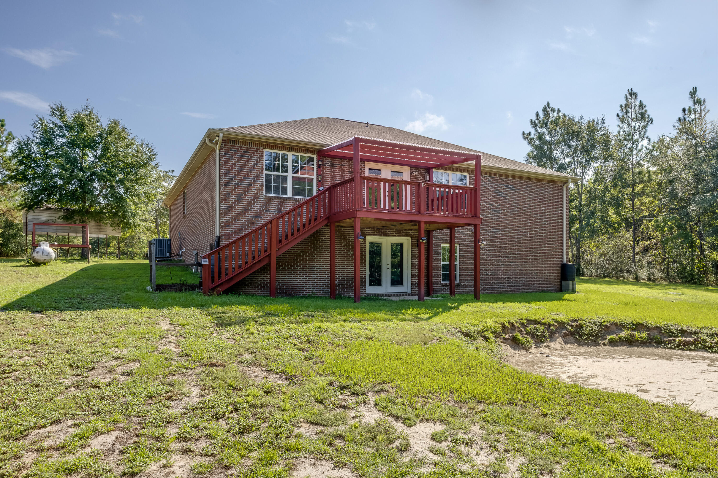 4555 Wolf Track Ridge, Unit 15 15 ACRES Crestview, FL 32539 - Photo 48 of 65 a view of a house with a yard