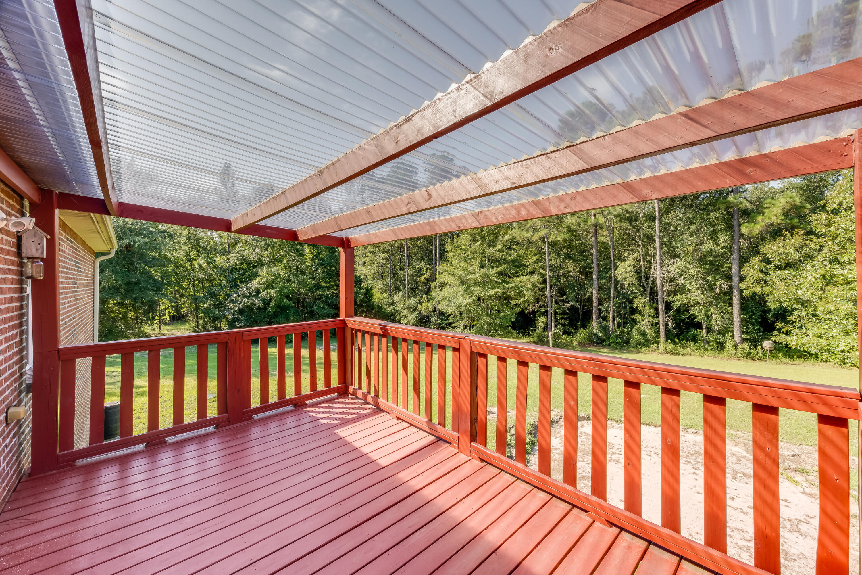 4555 Wolf Track Ridge, Unit 15 15 ACRES Crestview, FL 32539 - Photo 49 of 65 a porch with wooden floor in outdoor space