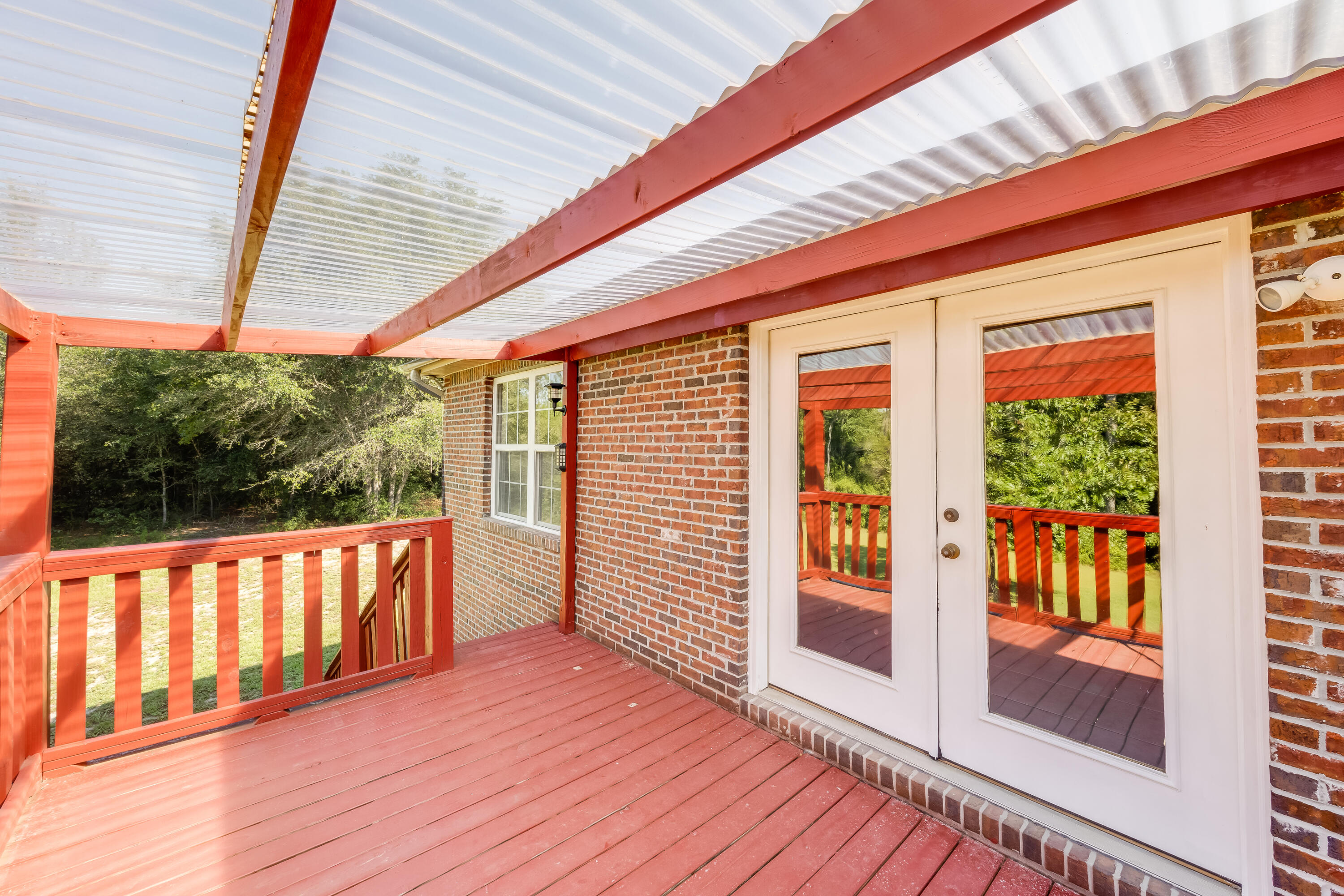 4555 Wolf Track Ridge, Unit 15 15 ACRES Crestview, FL 32539 - Photo 50 of 65 a view of a balcony with wooden floor