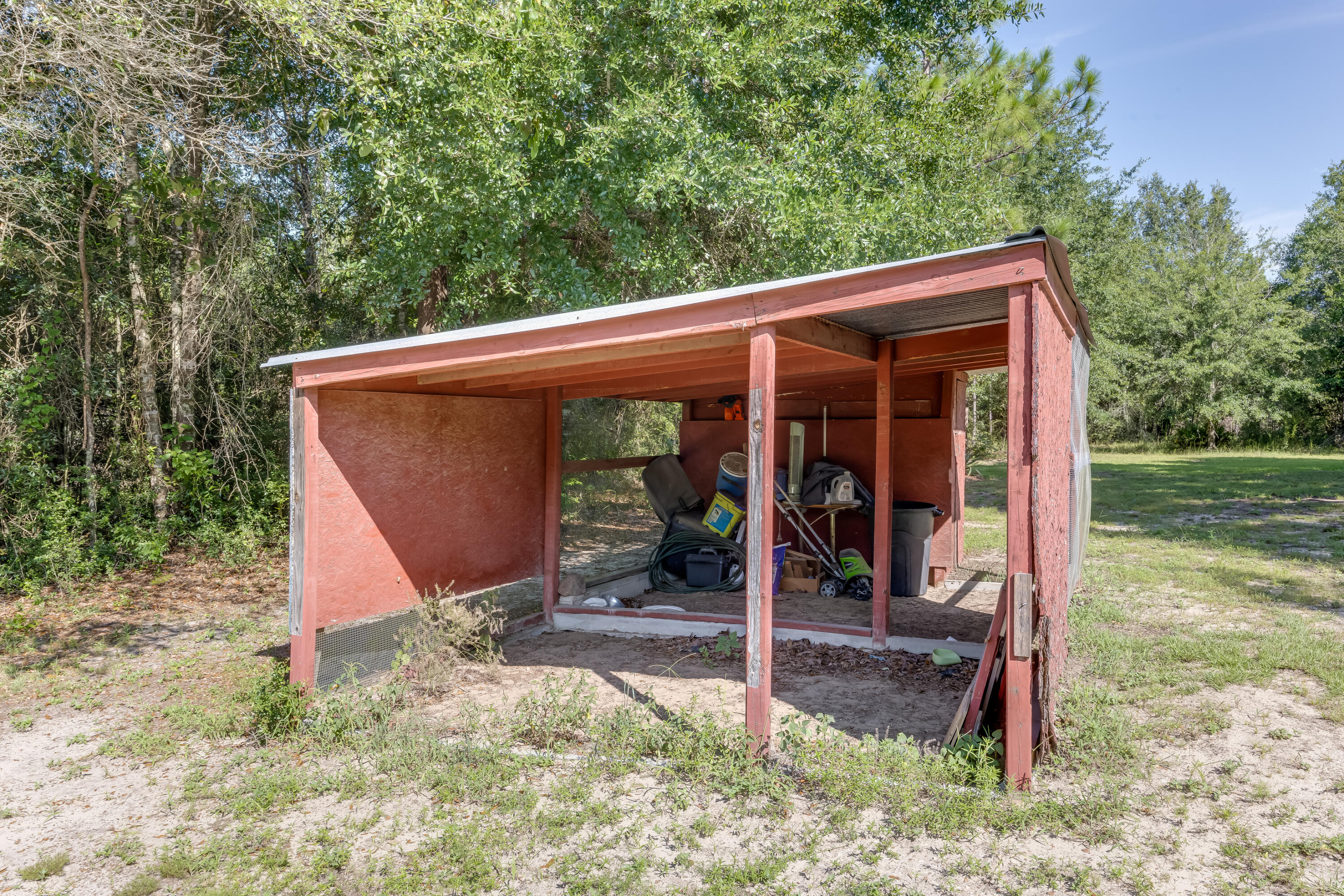 4555 Wolf Track Ridge, Unit 15 15 ACRES Crestview, FL 32539 - Photo 51 of 65 a view of a house with backyard and porch