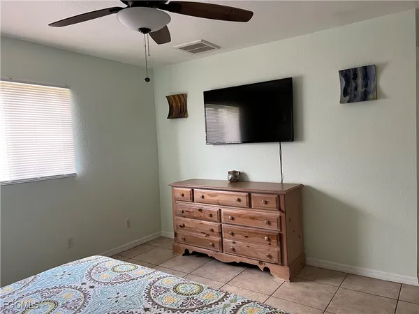 a room with furniture and flat screen tv