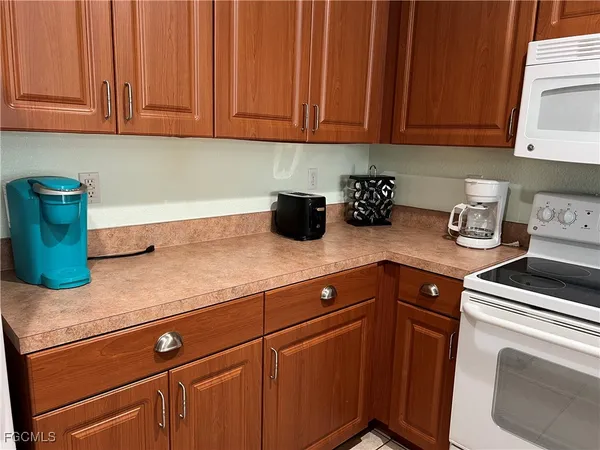 a kitchen with sink cabinets and utility