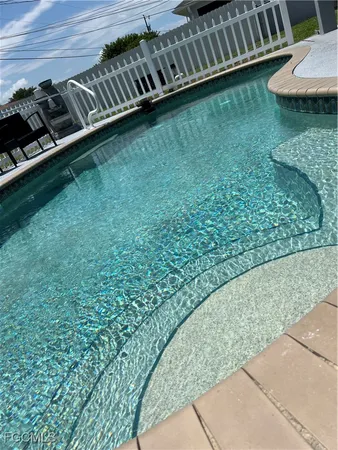 a view of a backyard of the house
