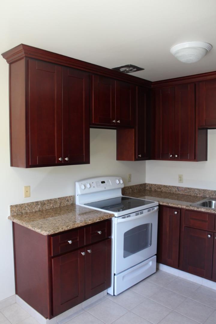 205 Avery Lane Los Gatos, CA 95032 - Photo 11 of 13 a kitchen with granite countertop wood cabinets and white appliances