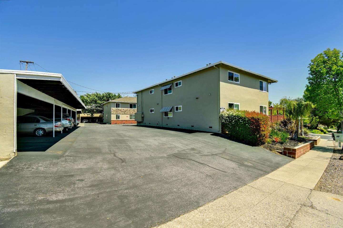 205 Avery Lane Los Gatos, CA 95032 - Photo 6 of 13 a backyard of a house with cars parked
