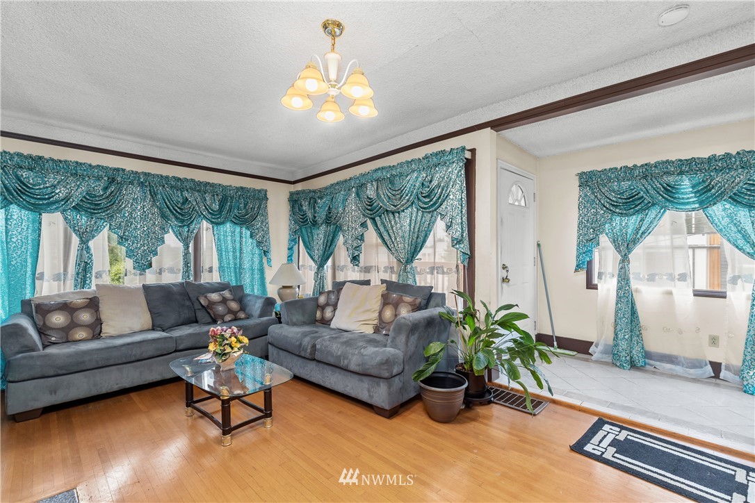 5069 Renton Avenue South Seattle, WA 98118 - Photo 11 of 40 a living room with furniture and a large window
